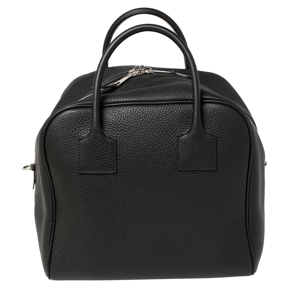A cute duffle bag can assist you with many outings and can be styled with most of your attires. Burberry's Cube bag is an example of the label’s penchant for creating staple pieces. It is crafted from leather in a black shade and features a zipper
