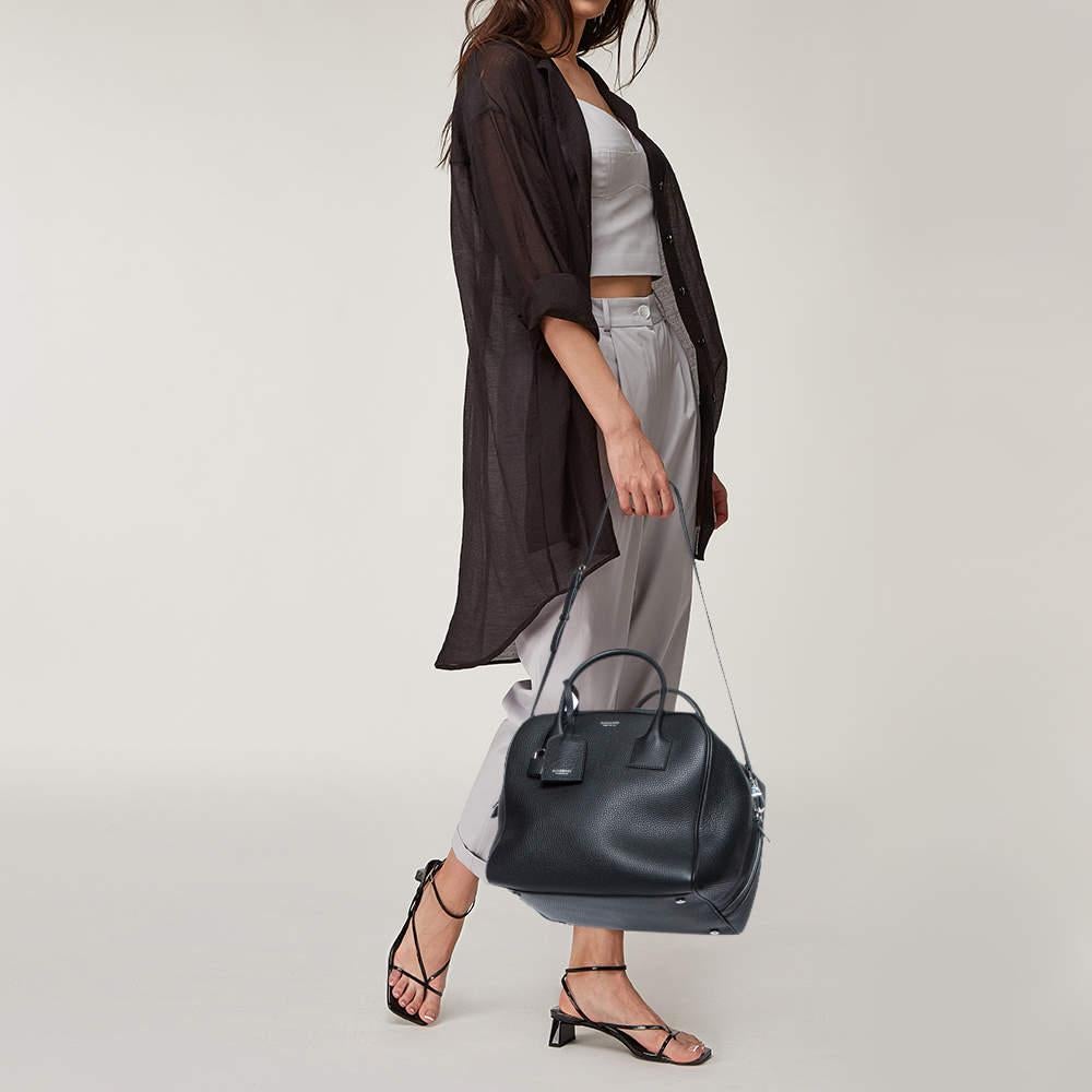 A structured and compact satchel can assist you with many outings and can be styled with most of your attires. Burberry's Cube bag is an example of the label’s penchant for creating staple pieces. It is crafted from leather in a black shade and