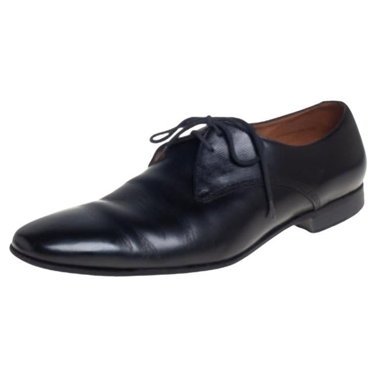 These Burberry Millstead oxfords will add a sharp touch to any formal outfit. Made from black leather, these lace-up oxfords feature round toes and a clean, polished finish. They are leather-lined and come with tough outsoles.