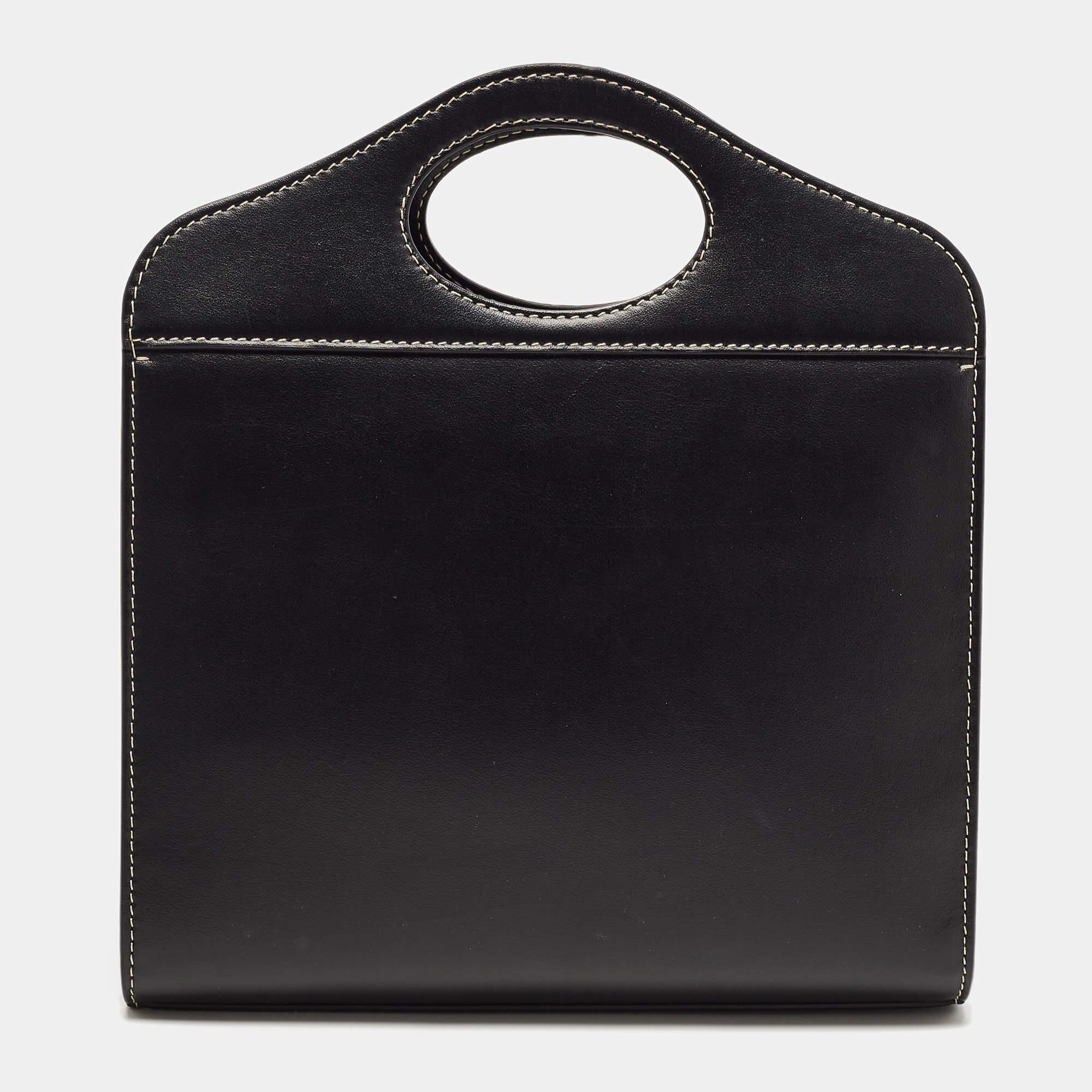 The architectural shape of this tote makes it distinct and fashionable. Made from premium materials, it can be carried around conveniently and it is equipped with a perfectly-sized interior.

Includes: Original Dustbag, Detachable Strap

Original