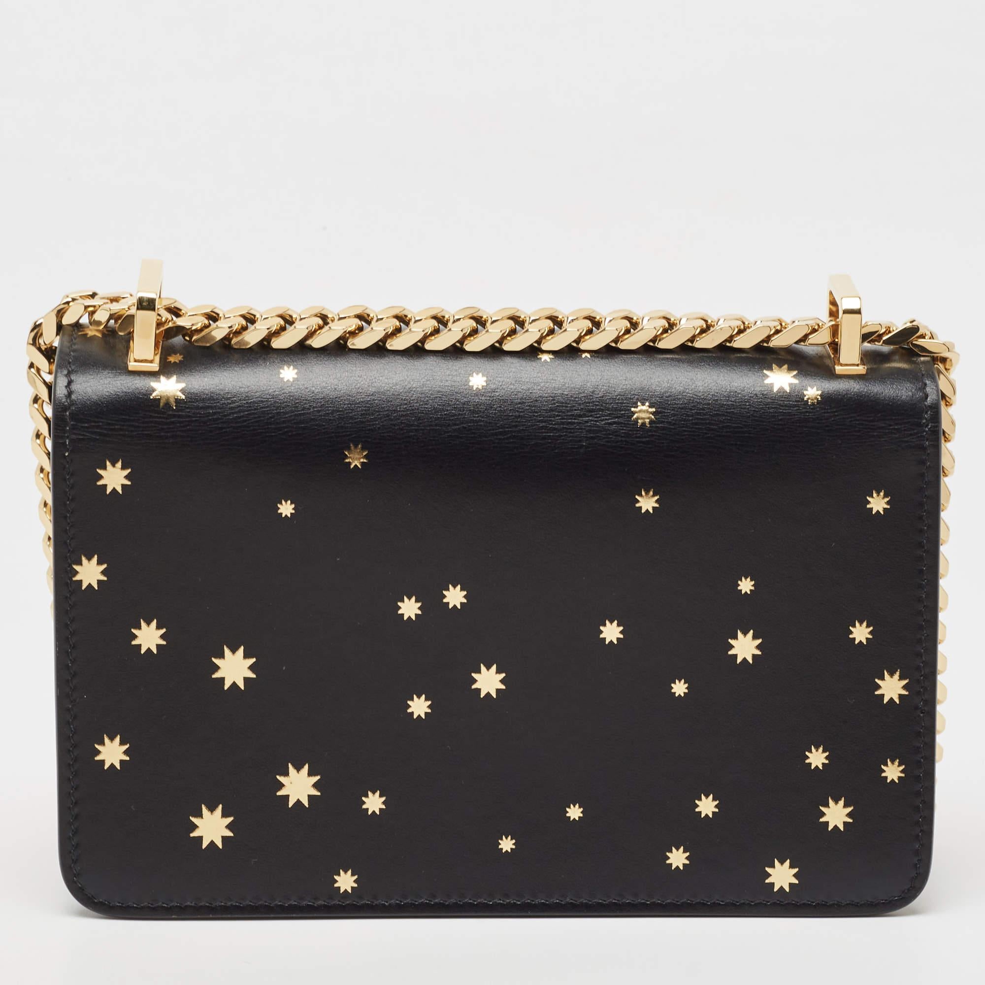 Burberry's black leather shoulder bag is a knowing investment piece that's on-trend now, too. It's finished with an elegant gold-tone metal TB clasp as well as an adjustable shoulder strap so it can be worn in a number of different ways. With more