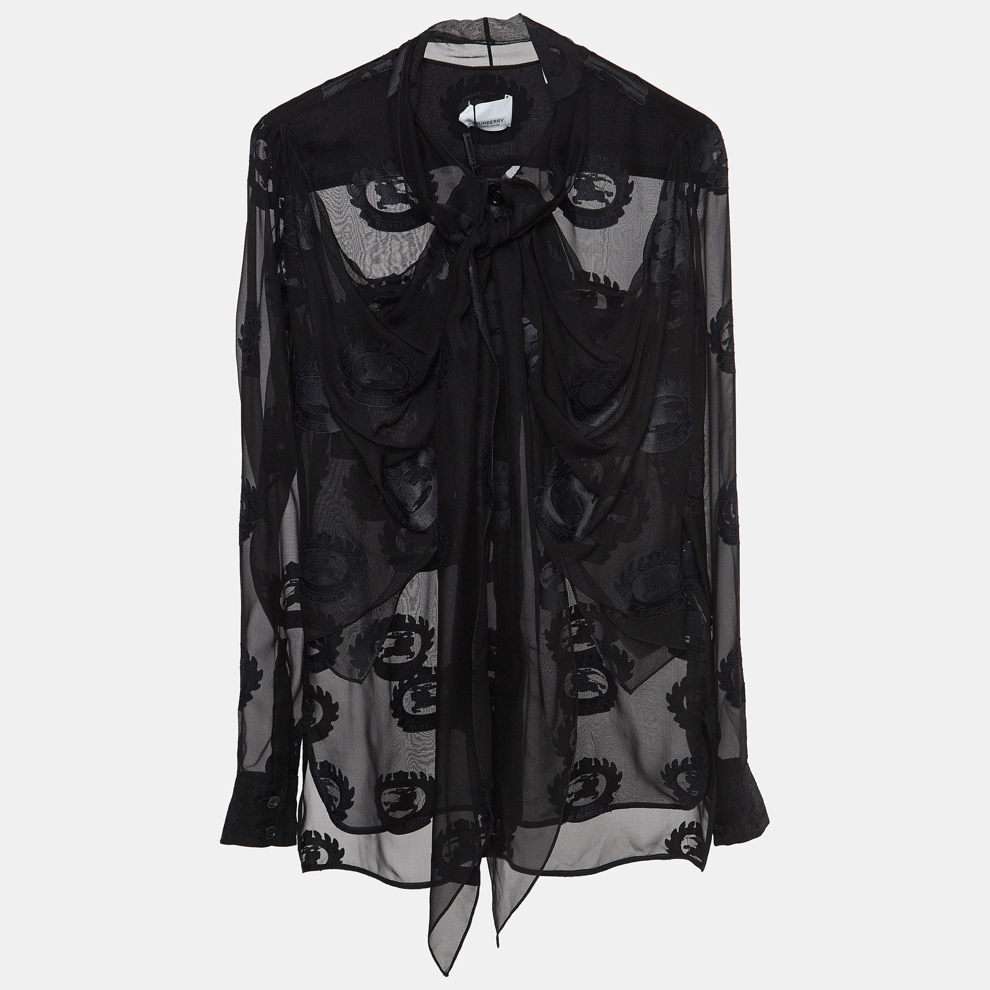 Crafted with precision, this Burberry sheer shirt blends luxury and functionality effortlessly. Team this fashion-forward essential with jeans to skirts and suits.

