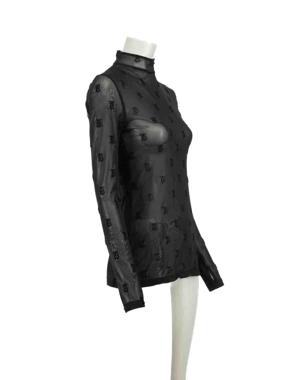 CONDITION is Very good. Hardly any visible wear to top is evident on this used Burberry designer resale item.
 
Details
Black
Synthetic
Top
Sheer
Logo pattern
Mock neck
Long sleeves
Back zip fastening
 
Composition
NO COMPOSITION LABEL BUT FEELS