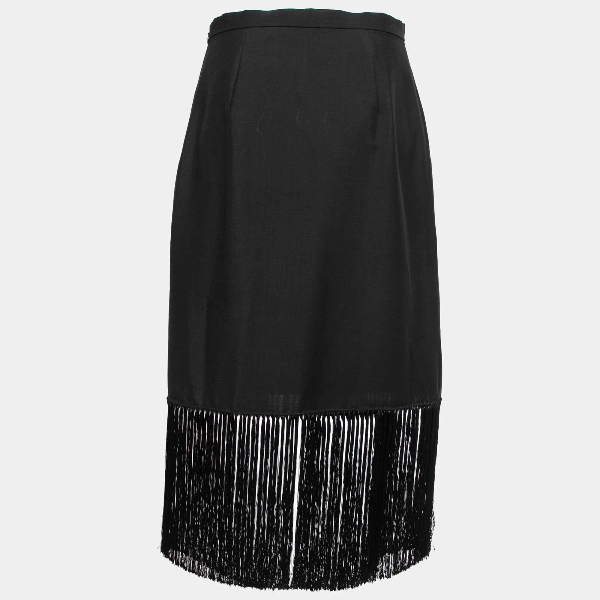 Experience the charm of designer clothing with this gorgeous Burberry skirt. Made from quality fabrics, the skirt has a simple allure and a great fit. Pair it up with a tailored blouse or a simple top and high heels.

Includes: Price Tag
