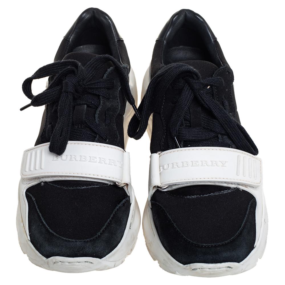 These black-white sneakers from Burberry are fashioned from a combination of Neoprene and suede into a stylish low-top silhouette. The Regis pair comes with lace-up vamps, velcro straps with brand-name details, and durable rubber soles. The sneakers