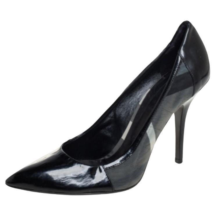 You are sure to fall head over heels in love with this pair of pumps from Burberry. These stylish pumps are crafted in Italy from patent leather and come in a shade of black. They are styled with pointed toes, logo on the counters and panels of