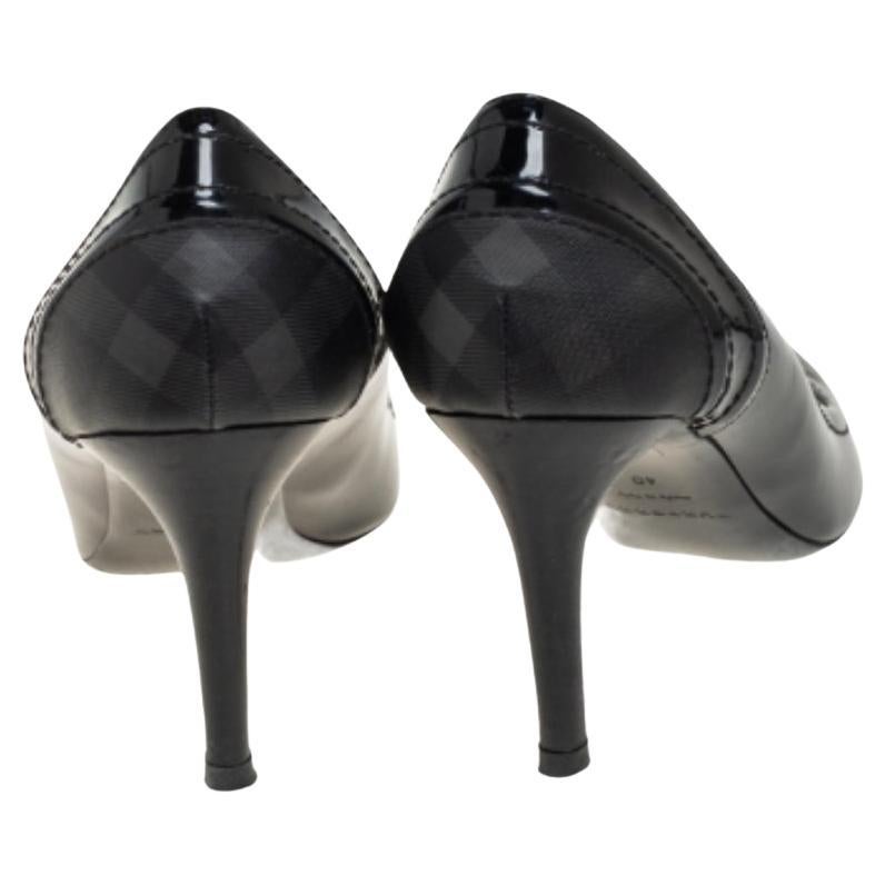 Work your magic while donning this pair of pumps made from patent leather and canvas. Burberry is known for its classy and chic designs just like this pair of pumps. They have almond toes and are raised on slender heels.