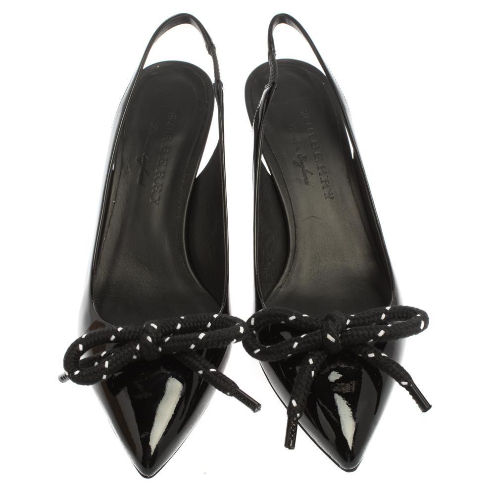 Your elegant feet deserve the best and what better than these Fink sandals from Burberry. The black sandals are crafted from patent leather and come with pointed toes, bow details, slingbacks, and 6 cm heels.

Includes: Original Box, Price Tag