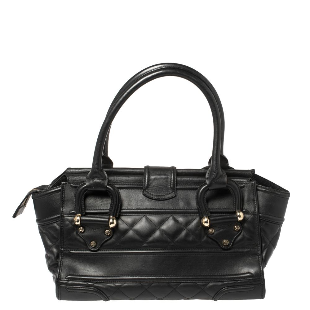 This Burberry Manor satchel is a timeless handbag that you will love for years to come. This creation is made from patent leather. The sturdy rolled leather handles, top zip closure, and front zip pocket, make this satchel ideal for everyday use.