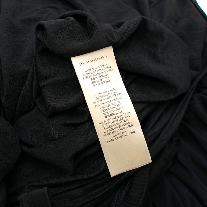 Burberry Black Ruched Mid-Length Skirt

- Invisible Side Zip Fastening 
- Mid-Length
- All over gathered/ruched Skirt 
- Fitted Waistband 
- Fully Lined

Materials 
96% Viscose 
4% Elastane 
Lining 
100% Polyester 

Dry Clean Only 

Made in Bulgaria