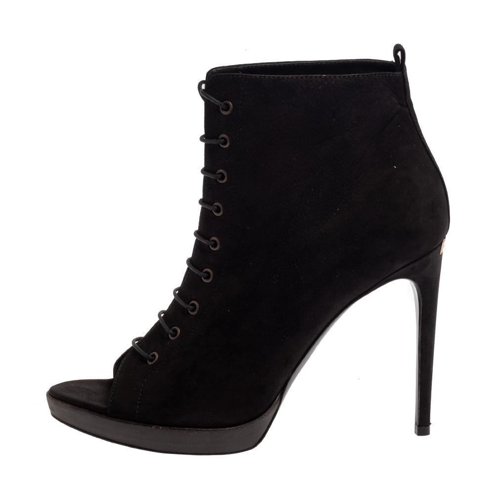 These ankle booties from Burberry have been designed to present a fashion-forward appeal. The peep-toe booties are covered in black suede and designed with lace-ups along the front and 12 cm slim high heels.

Includes:Original Box, Extra Heel Tip
