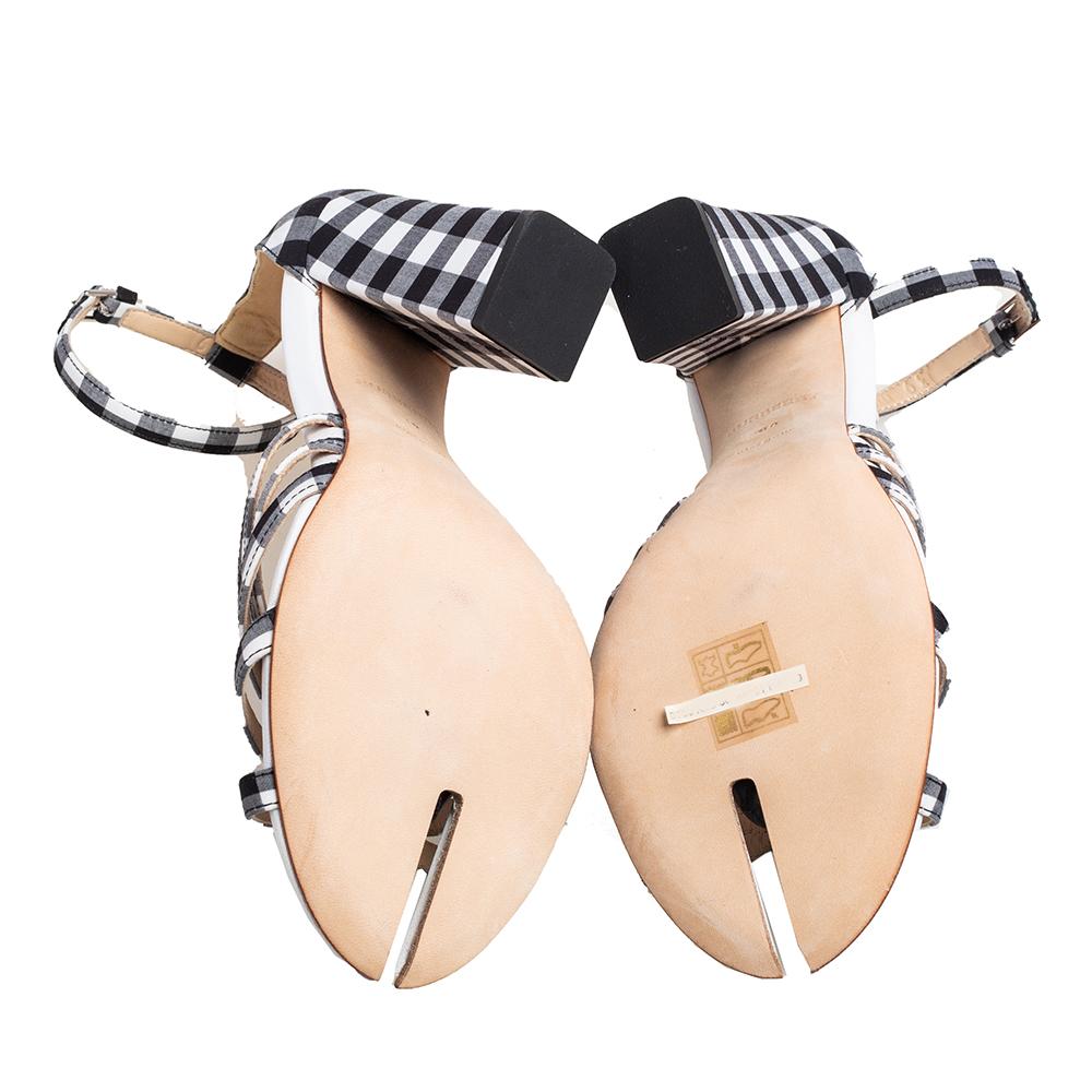 Burberry Hove heel sandals secured with checkered fabric straps and ankle buckle closure. The sandals are beautified with block heels and split detailing at the toe beds.

Includes: Original Dustbag, Original Box, Price Tag, Info Booklet, Brand Tag