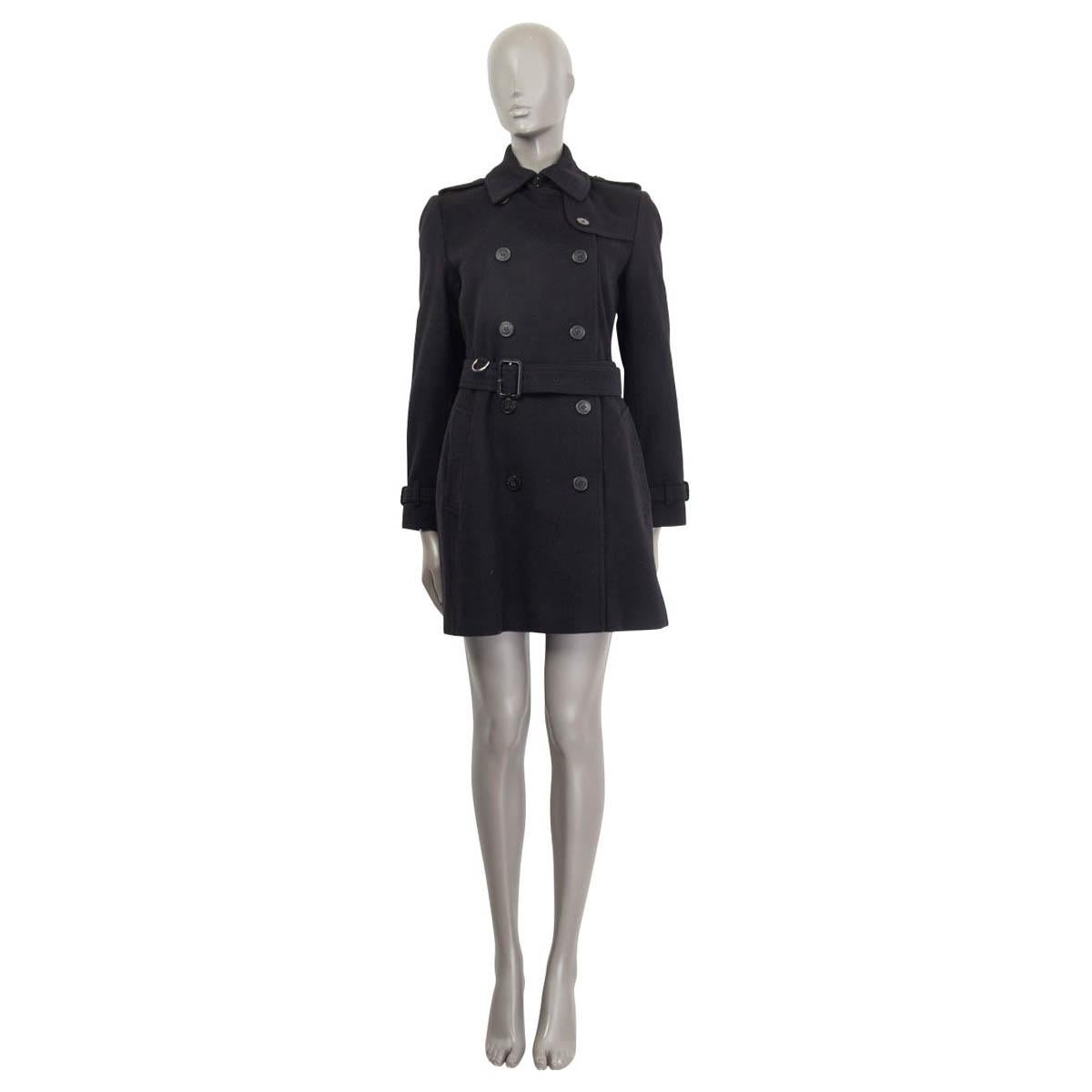 100% authentic Burberry 'Kensington' double breasted trench coat in black virgin wool (80%) and cashmere (20%). Embellished with epaulettes on the shoulders and comes with a belt. Opens with a concealed hook on the neck and seven buttons on the