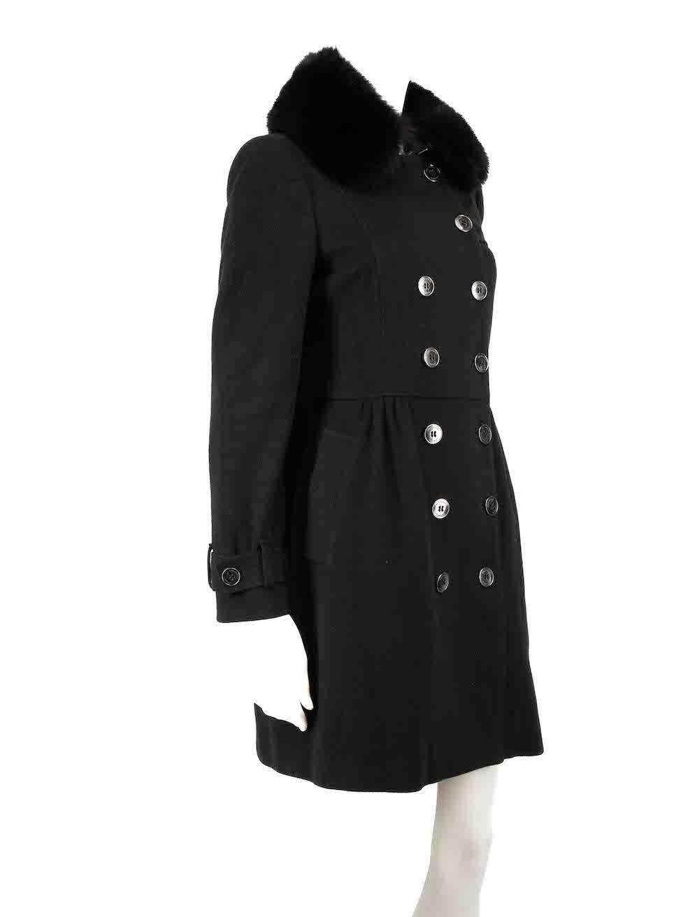 CONDITION is Very good. Minimal wear to coat is evident. Minimal wear to the exterior texture with light pilling on this used Burberry designer resale item.
 
 
 
 Details
 
 
 Black
 
 Wool
 
 Mid length coat
 
 Double breasted
 
 Buttoned cuffs
 
