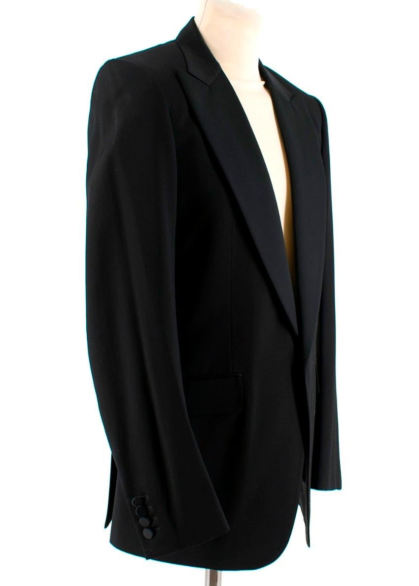 Burberry Black Wool Hand-Tailored Tuxedo. RRP £2290
Jacket:

- Beautiful heavy weight tuxedo jacket
- English Classic
- Single button fastening
- Four buttons on each cuff
- Two large pockets on each side and one small breastpocket
- One button-up