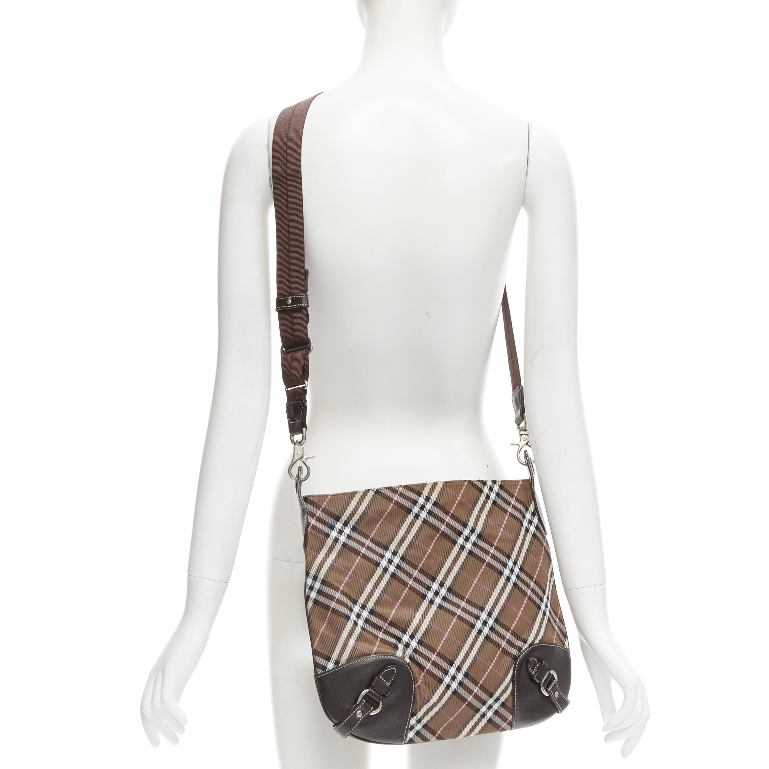 BURBERRY BLUE LABEL brown House Check leather buckle crossbody messenger bag
Brand: Burberry
Collection: House Check 
Color: Brown
Pattern: Checkered
Closure: Zip
Extra Detail: Detachable nylon sports strap. House Check upper. Silver-tone hardware.