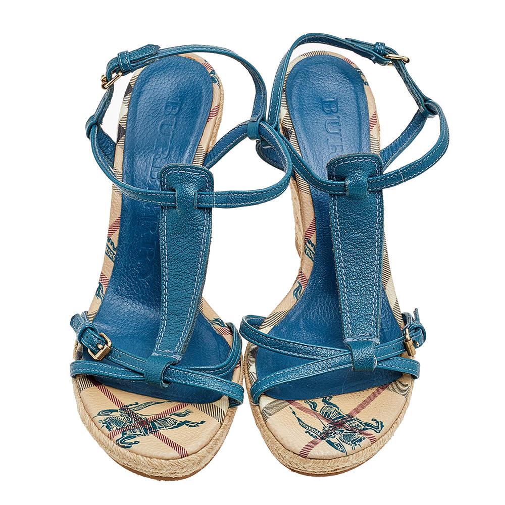 Update your footwear collection by adding these sandals from Burberry. They are made from blue leather on the exterior, with buckled-strap details and espadrilles added to their structure. Looking nothing but stylish as you wear these sandals.

