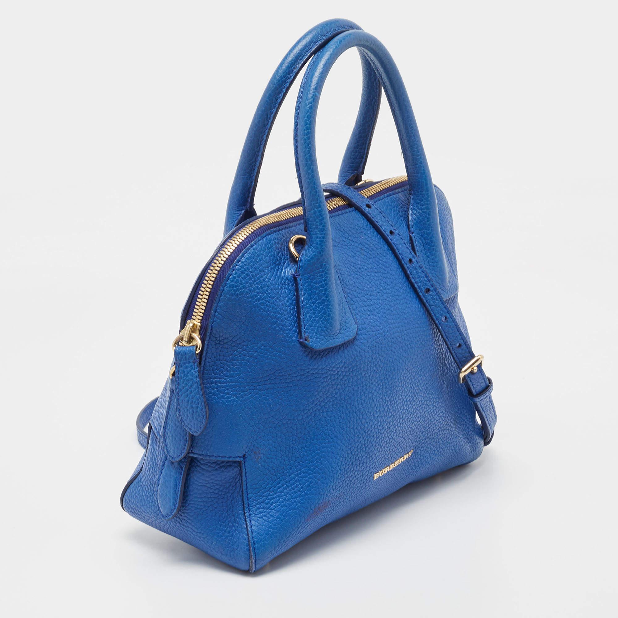 This beautifully crafted pebbled leather satchel will surely fetch you a lot of compliments. The fine fabric on the inside of the bag is well lined. This Burberry bag is simply unmatched in its grandeur and trendy design. This blue bag is sure to be