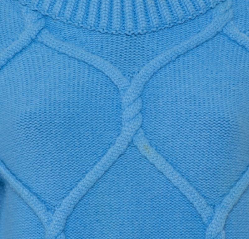 Burberry delights us with this wonderful blue sweater. It is made from wool and cashmere and styled with cable  & ruffle details, long sleeves and ribbed trims. The sweater will be a lovely addition to your closet.