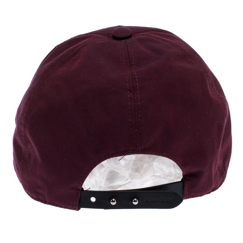 Put the finishing touch to your outfit with this Boysenberry cap by Burberry. This trendy piece is made from burgundy cotton with logo embroidery and an adjustable strap at the back. The interior houses the brand label.

Includes: The Luxury Closet