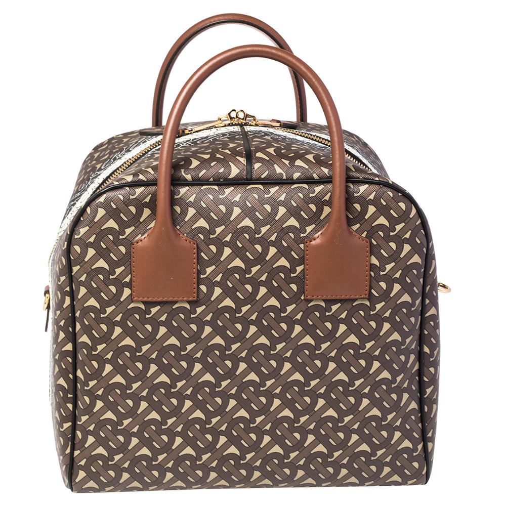 A cute duffle bag can assist you with many outings and can be styled with most of your attires. Burberry's Cube bag is an example of the label’s penchant for creating staple pieces. It is crafted from monogram coated canvas and features a zipper