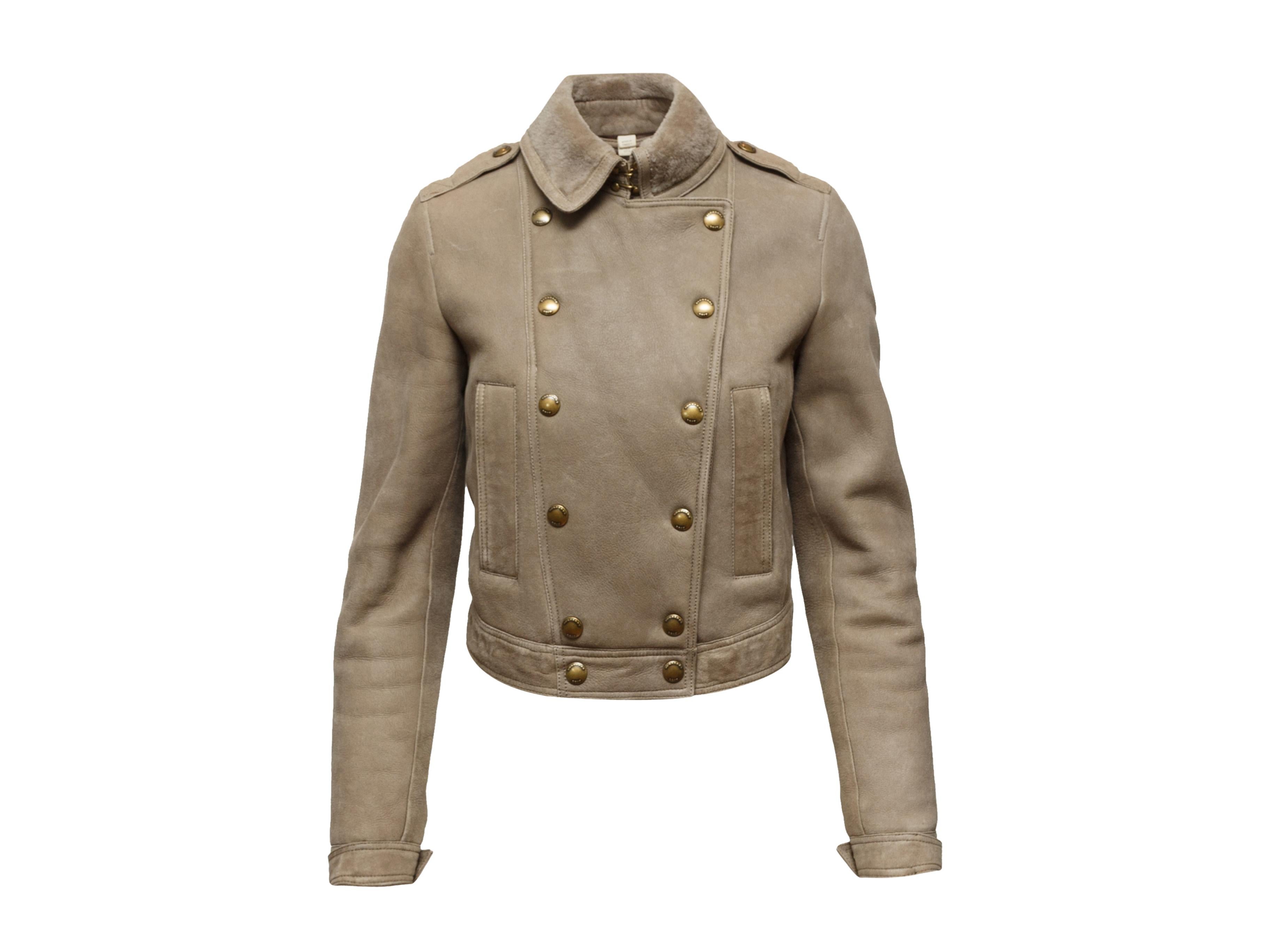 Product details: Beige double-breasted shearling jacket by Burberry Brit. Foldover collar. Dual pockets at hips. Gold-tone button closures at front. Designer size UK6. 24