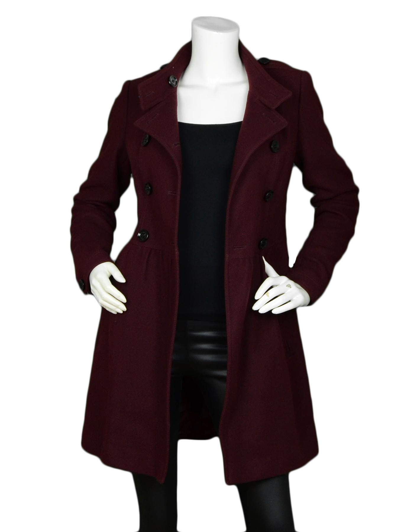 Burberry Brit Burgundy Wool Double Breasted Coat sz 4

Made In: Bosnia
Color: Burgundy
Materials: 70% Wool, 25% Polyamide, 5% Cashmere
Lining: 100% Viscose
Opening/Closure: Front Buttons
Overall Condition: Excellent pre-owned condition
Includes: