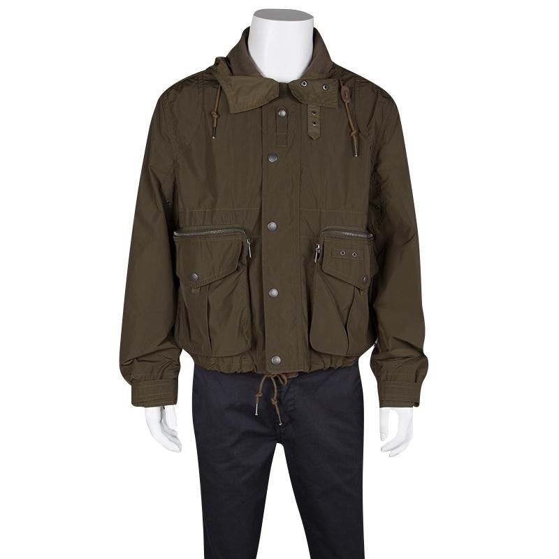 You can trek through easily in the harsh weather by wearing this Burberry jacket made from good quality fabric. It is embellished with drawstring hood and metal buttons at the closure. The long sleeves and hemline have the ribbed trim and the bulky