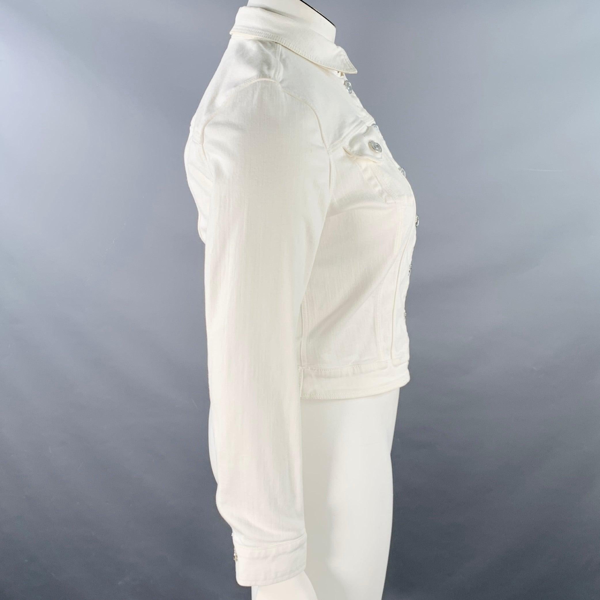 BURBERRY BRIT jacket
in a cream cotton stretch blend denim featuring a Type III design with two buttoned pockets, and button closure with hook & eye at neck. Excellent Pre-Owned Condition. 

Marked:   L 

Measurements: 
 
Shoulder: 15.5 inches Bust: