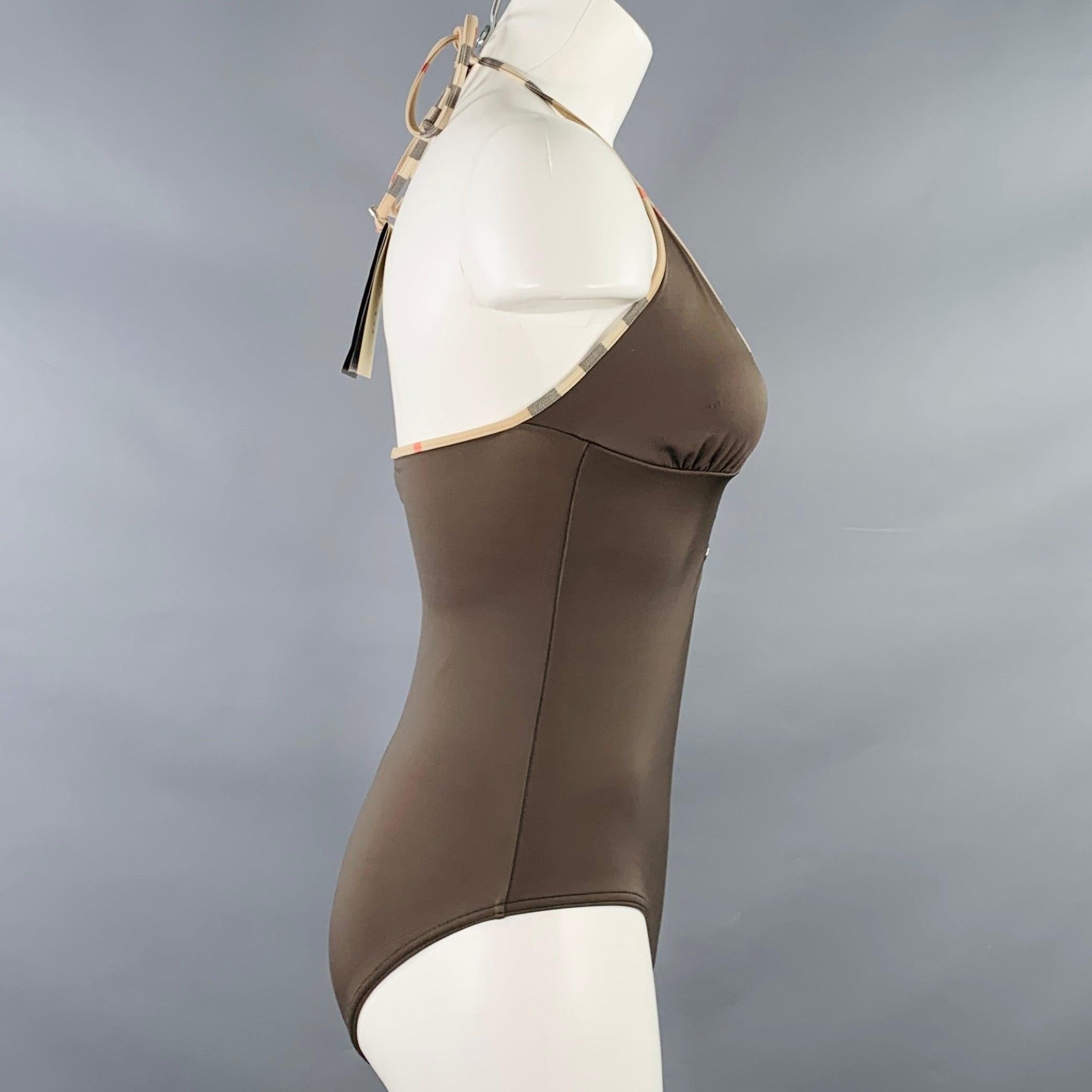 BURBERRY BRIT swimsuit
in a brown and beige polyamide stretch blend fabric featuring a halter style, signature BURBERRY check trim, and three button detail. Comes with Tags.Good Pre-Owned Condition with Tags. Moderate signs of wear. 

Marked:   S