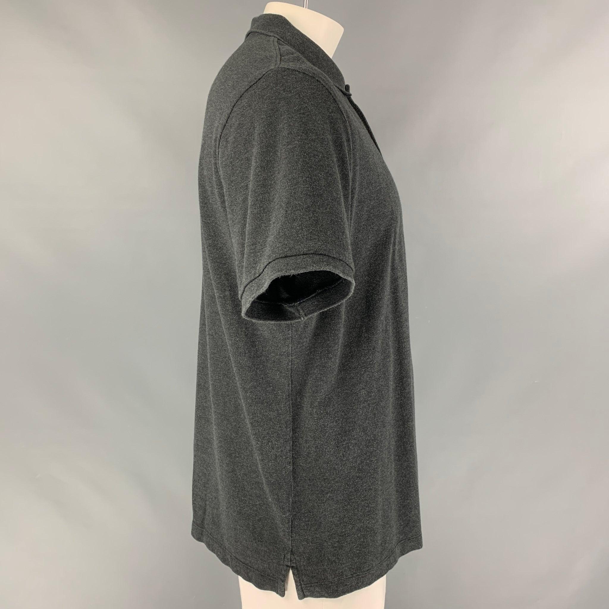 BURBERRY BRIT polo shirt comes in a dark grey cotton piquet featuring the signature plaid trim.
 Very Good Pre-Owned Condition. Minor sign of wear. 

Marked:   XXL 

Measurements: 
 
Shoulder: 20 inches Chest: 50 inches Sleeve: 9.5 inches Length: 29