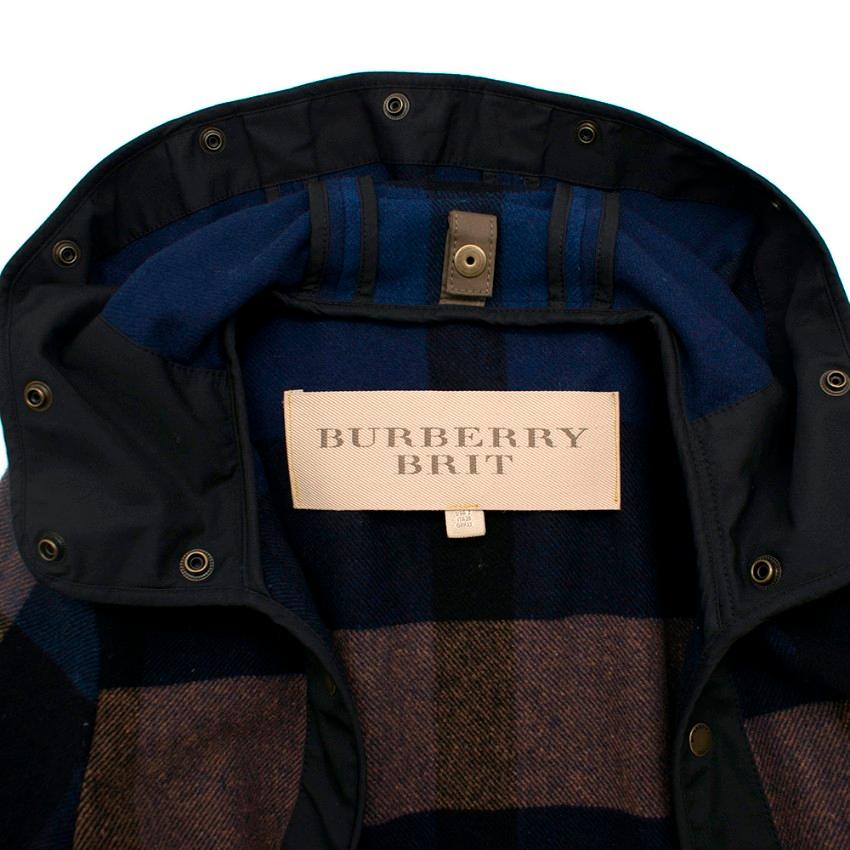 Burberry Brit Wool Check Hooded Coat 

- Unlined
- soft wool body
- Decorative buttons at the front and at the hood with logo
- Classic check pattern in blue/black/brown

Approximate
Measurements are taken laying flat, seam to seam. 

Shoulders 11.5