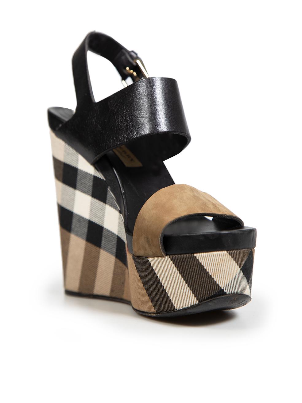 CONDITION is Good. General wear to sandals is evident. The toe straps have some light abrasions and gentle creasing to the leather. There are abrasions along the insole edges and outsole edges. There are light markings across wedge material. Soles