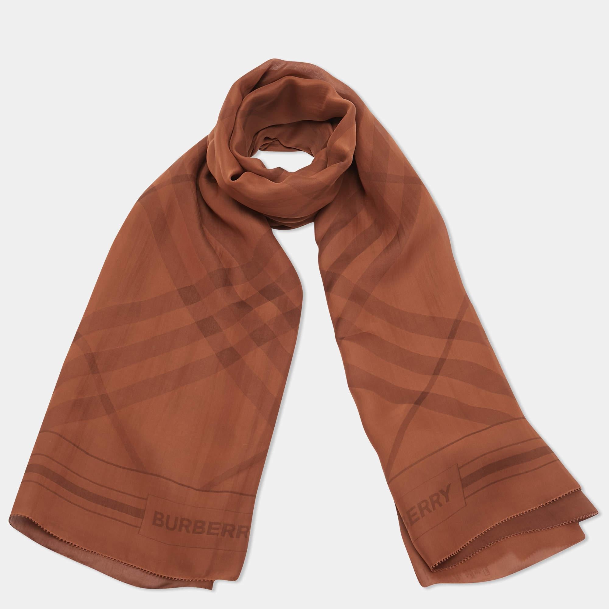 This lovely scarf is a fun way to accessorize your casual outfits and statement totes. This scarf from Burberry features an interesting design. It is cut from smooth fabric and will elevate all your looks.

Includes: Brand Tag