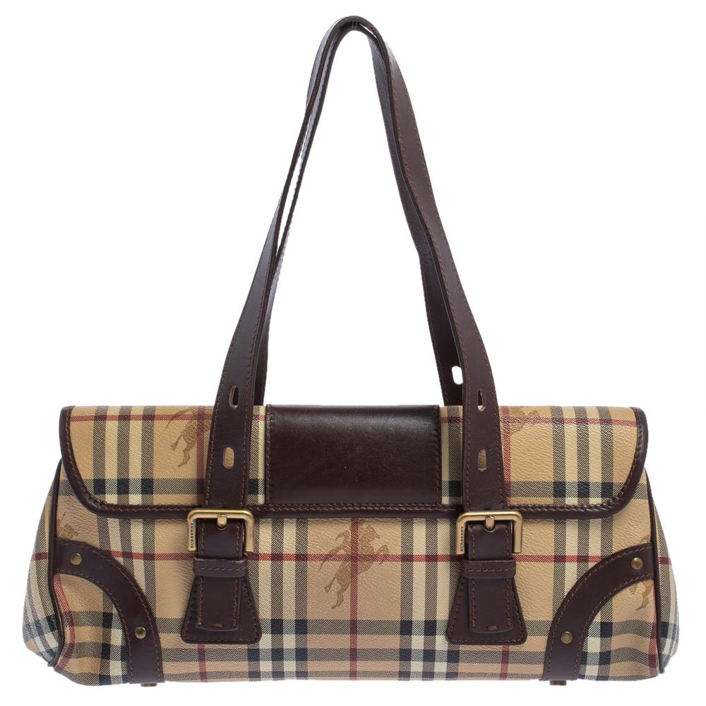 This shoulder bag from Burberry has been designed to be a worthy style companion! Crafted from Haymarket Check coated canvas and leather, the bag features a flap closure and gold-tone hardware. It is equipped with two handles and a canvas-lined