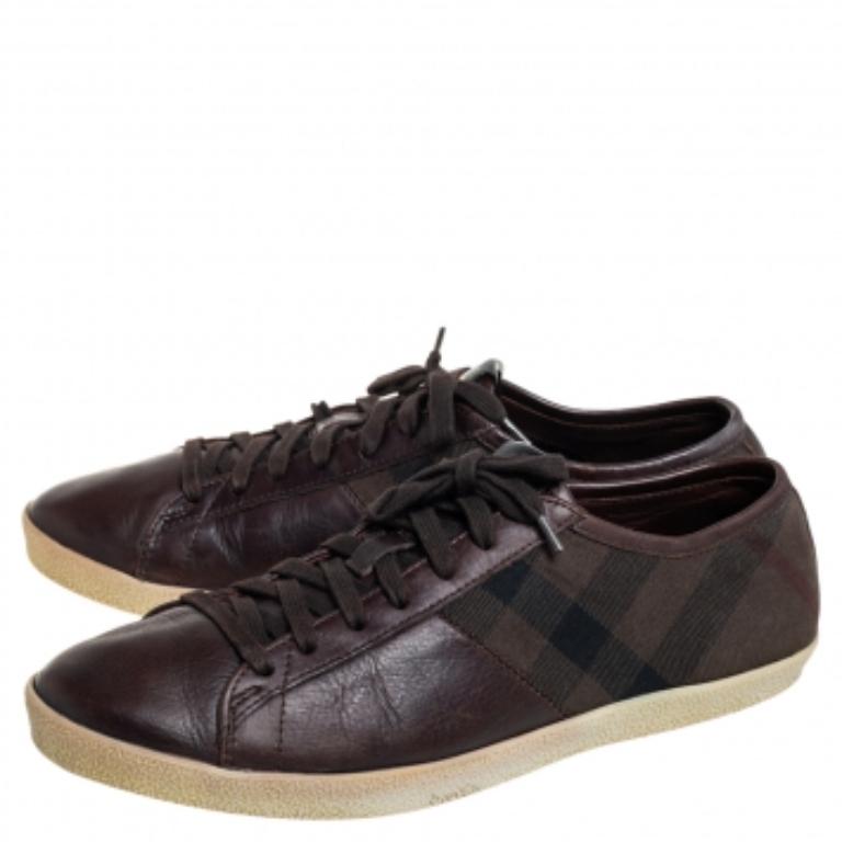 These sneakers from Burberry are truly a maker of trends. The brown sneakers are designed in a low-top profile using check canvas and leather. Finished with lace-ups and brand details on the tongues, this pair is high in comfort and style, just