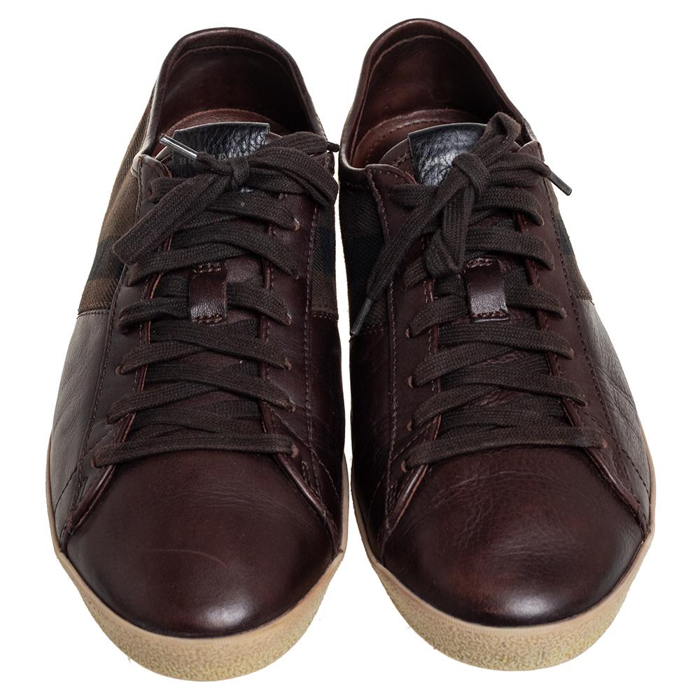 These sneakers from Burberry are truly a maker of trends. The brown sneakers are designed in a low-top profile using check canvas and leather. Finished with lace-ups and brand details on the tongues, this pair is high in comfort and style, just