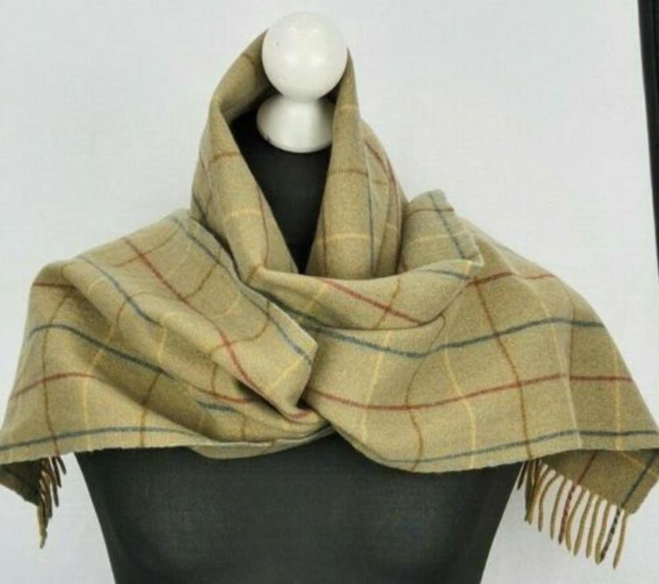 This Burberry scarf is in good condition no holes no tears, no stains
Tassels are complete and intact at both ends 
Light weight scarf made of 100%LAMBSWOOL
It has been dry cleaned so you will receive it in ready to wear condition 
 
 
Size
Length: