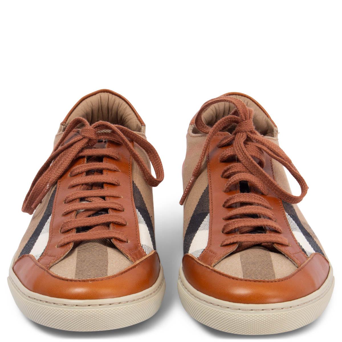 100% authentic Burberry lace-up canvas sneakers in camel, black, red and white calssic check with congac leather trimming. Have been worn and are in excellent condition. 

Measurements
Imprinted Size	39
Shoe Size	39
Inside Sole	26cm