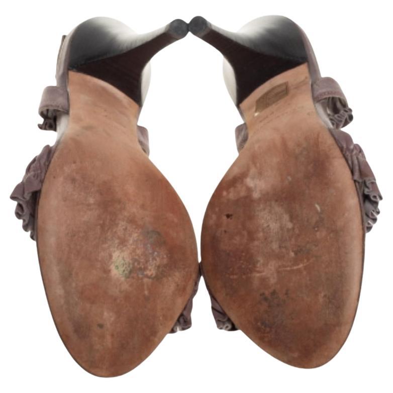 Burberry yet again brings a stunning set of sandals that makes us marvel at its beauty and craftsmanship. This versatile pair has been crafted from leather in a brown shade and detailed with ruffles.