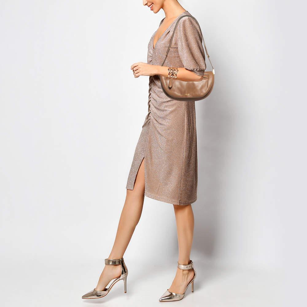 For a look that is complete with style taste and a touch of luxe this designer bag is the perfect addition. Flaunt this beauty on your shoulder and revel in the taste of luxury it leaves you with.