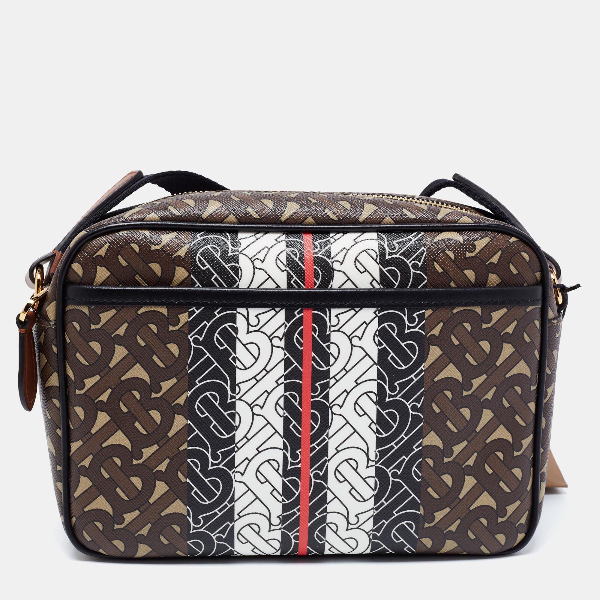 Burberry's TB monogram gives any creation a modern update. This crossbody bag is a case in point. It is covered in TB-print coated canvas in luxe shades, transforming the classic camera-bag silhouette into a contemporary accessory.

Includes: brand