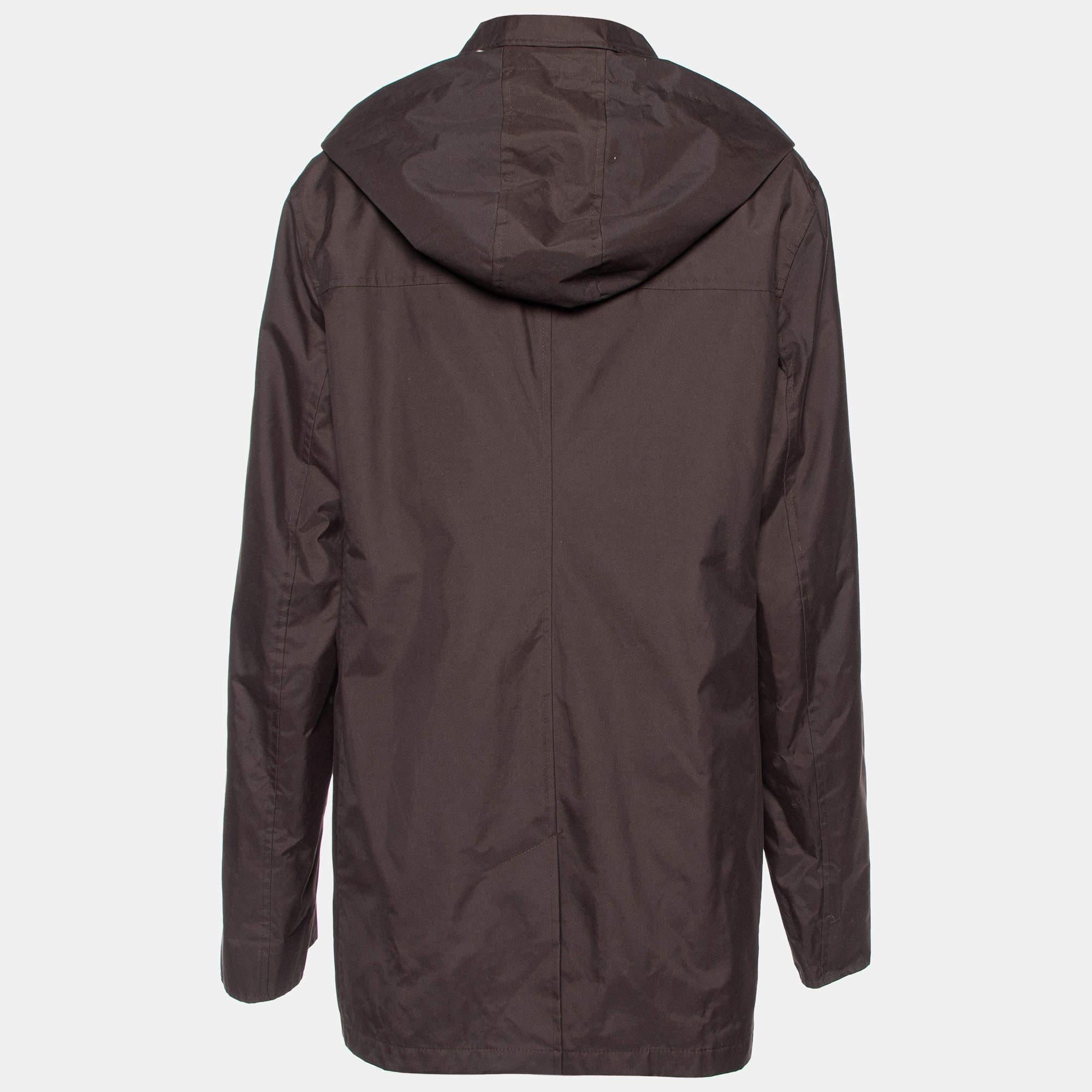 The Burberry Kayla Jacket is a stylish and functional outerwear piece. Crafted in rich brown polyester, it features a double lining for warmth, a protective hood, and the iconic Burberry design for a fashionable yet cozy cold-weather
