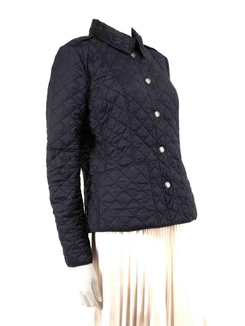 CONDITION is Good. Minor wear to jacket is evident. Light wear to the quilted stitching with a number of plucked and stray threads found throughout the exterior and lining on this used Burberry Brit designer resale item.
 
 
 
 Details
 
 
 Vintage