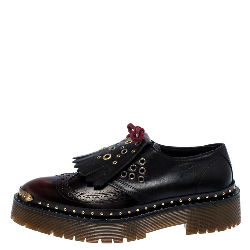 Ready to offer comfort and style, this pair of sneakers by Burberry will make a fantastic addition to your shoe collection. They've been crafted from burgundy leather and styled with ties and fringe details on the uppers. Studs and platforms