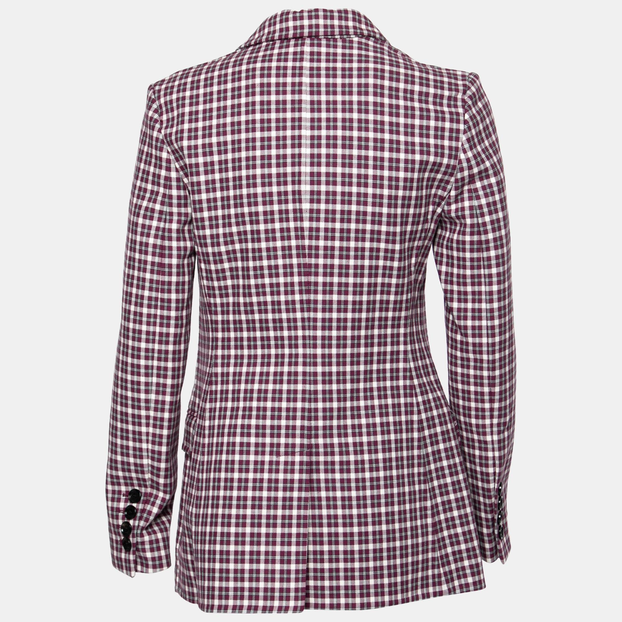 Fashionable and functional, this jacket from the House of Burberry helps you sport a sophisticated style while wearing it. Tailored using burgundy cotton fabric and embellished with checkered prints, this jacket exhibits buttoned closures and long