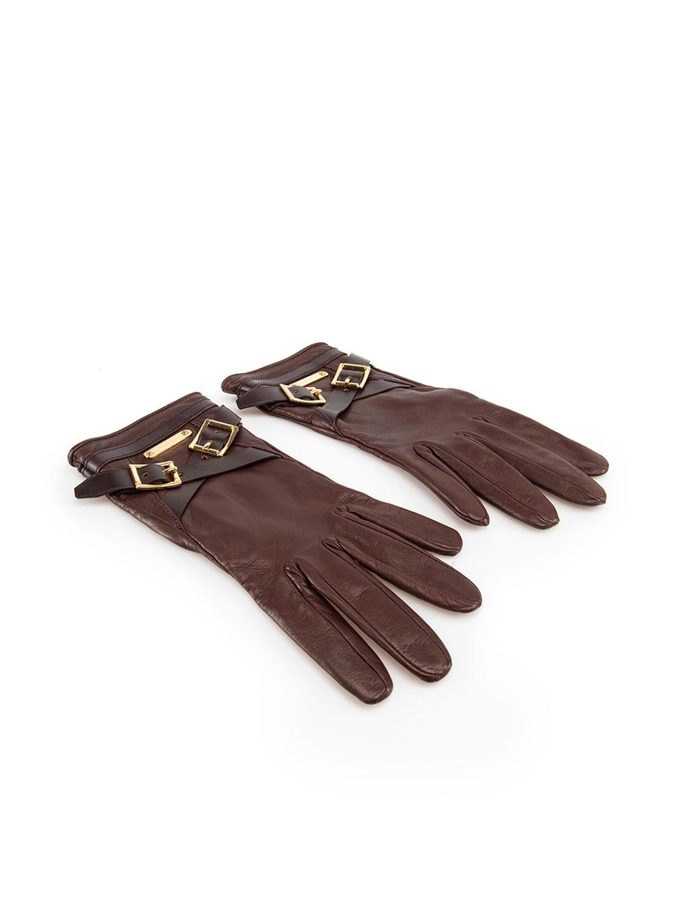 CONDITION is Very good. Minimal wear to gloves is evident. Minimal wear to the left glove index finger and the right glove leather strapping with very light scratches to the leather on this used Burberry designer resale item.
 
 Details
 Burgundy
