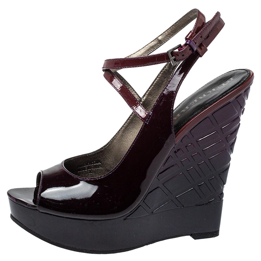 This beautiful pair of patent leather sandals will bring you a confident, comfortable walk. Set on check wedges and a leather base, these uber-stylish sandals are perfect for any season. The Burberry pair in burgundy will be a prized buy.

Includes: