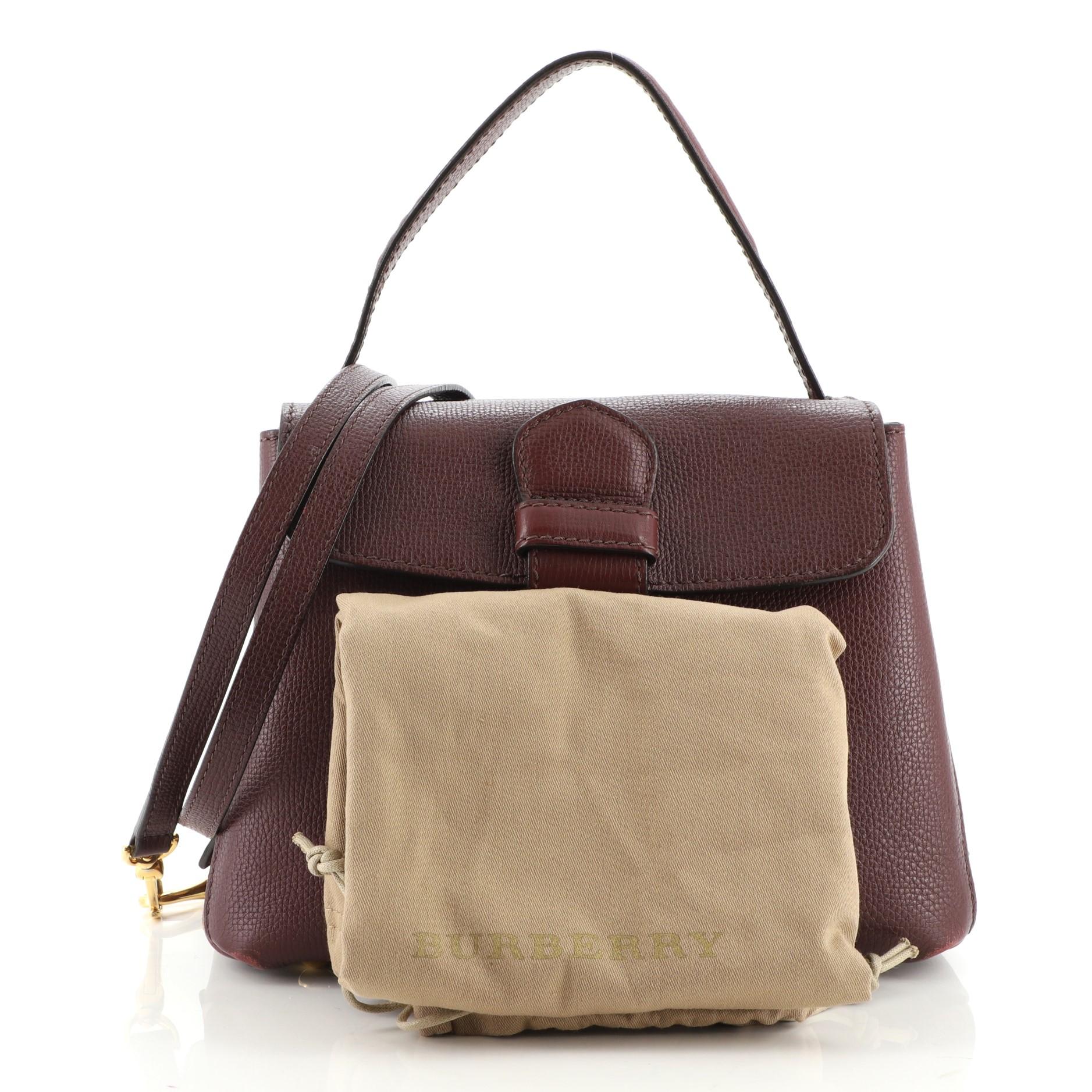 Condition: Fair. Moderate wear and discoloration on base corners, wear and bubbling on handle, wear on strap. Heavy cracking on handle, strap, flap and opening wax edges, peeling and splitting on opening corner wax edges. Wear and stains in