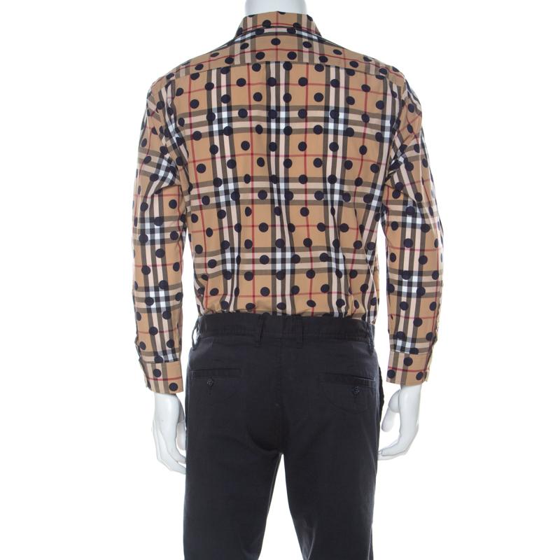 This Burberry shirt offers a relaxed feel and a classic touch of style. It is tailored from cotton and covered in Nova Check and polka dots. A simple collar, front buttons, and long sleeves make it ready to be worn by you.

Includes: The Luxury